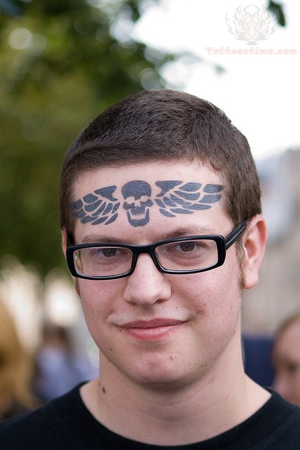 Winged Skull Tattoo On Forehead
