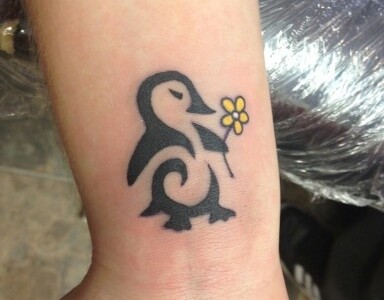 Yellow Flower And Penguin Tattoo On Wrist