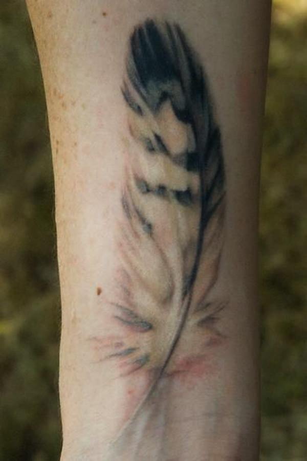 Amazing Pigeon Feather Tattoo Design For Wrist