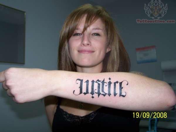 Ambigram Justice Word Tattoo On Girl Left Arm