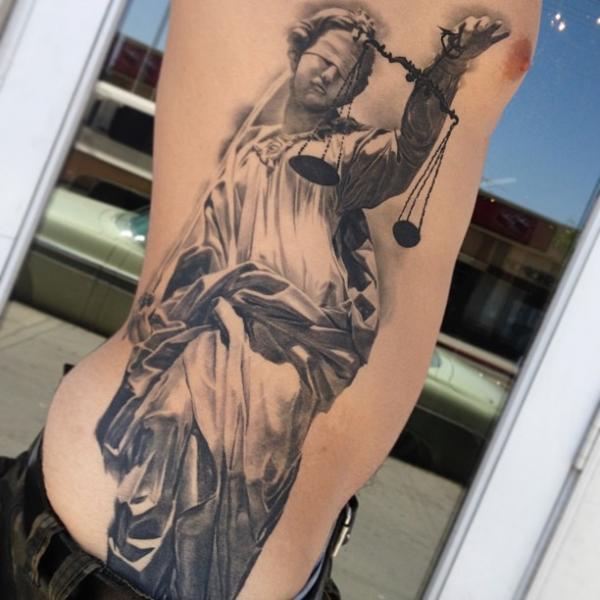Black And Grey 3D Blind Justice Tattoo On Man Side Rib