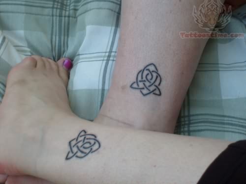 Black Celtic Knot Tattoo On Couple Leg