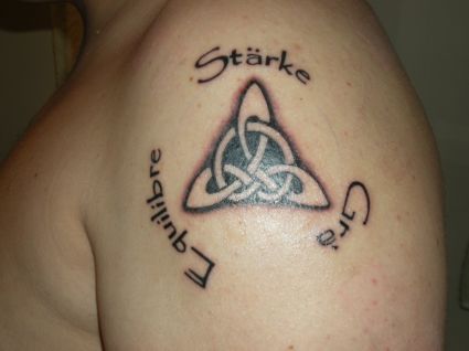Black Celtic Knot Tattoo On Left Shoulder