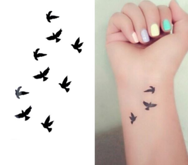 Black Flying Pigeons Tattoo Design For Wrist