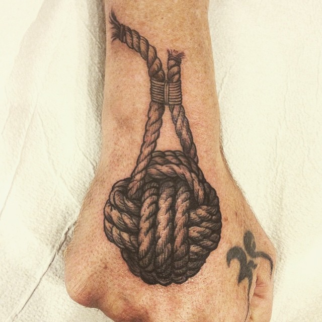 Black Ink 3D Rope Knot Tattoo On Hand