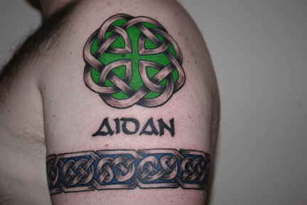 Black Ink Celtic Knot Tattoo On Man Left Shoulder