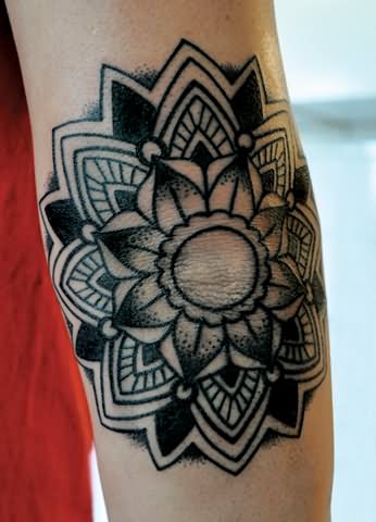 Black Ink Flower Tattoo On Elbow