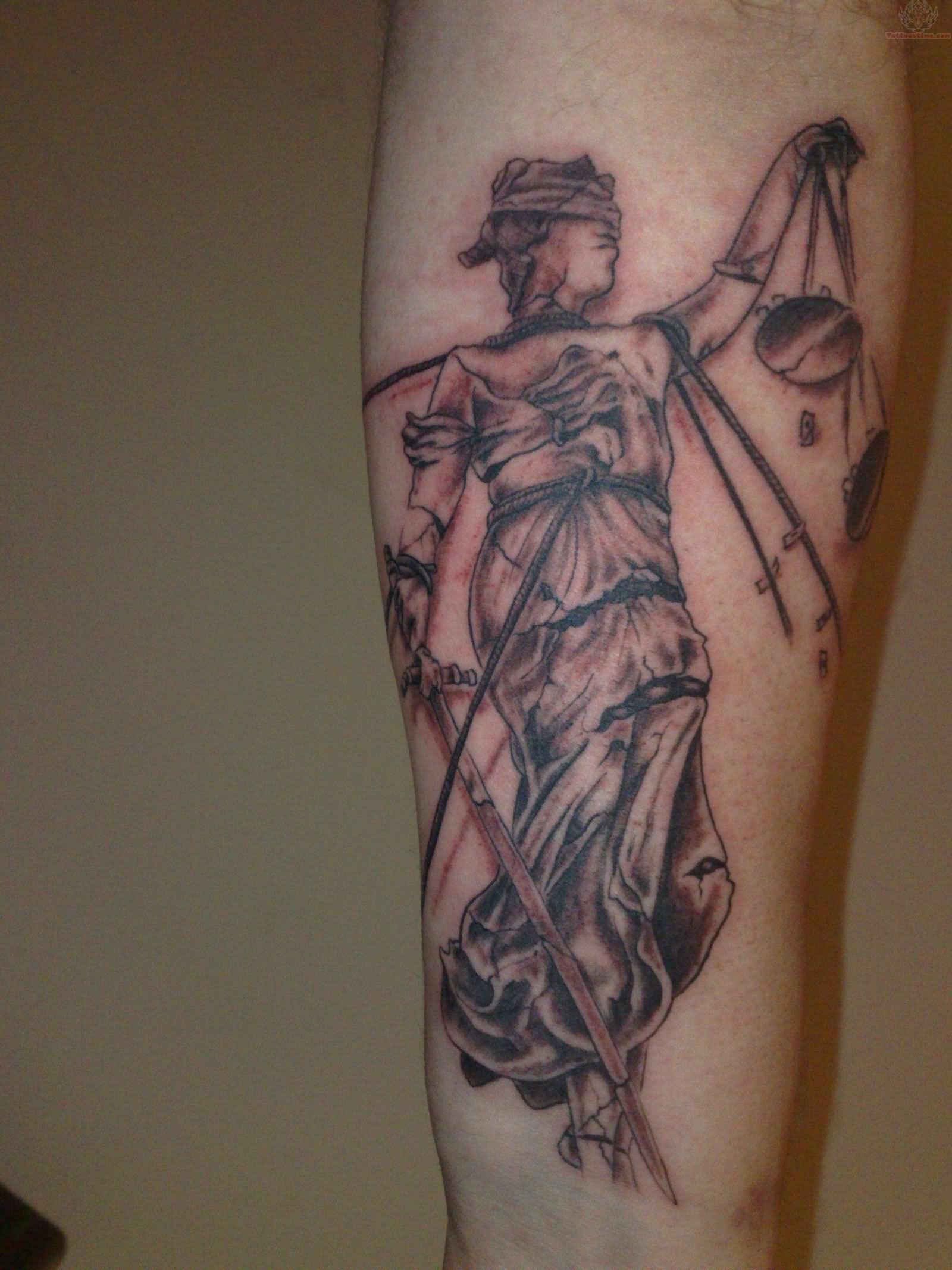 Black Ink Justice Tattoo Design For Arm
