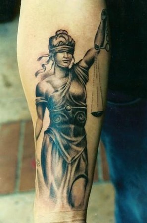 Black Ink Justice Tattoo Design For Forearm