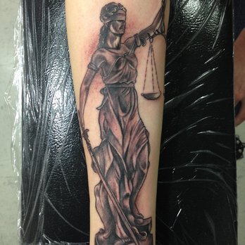 Black Ink Justice scale And Sword In Lady Hand Tattoo Design For Forearm