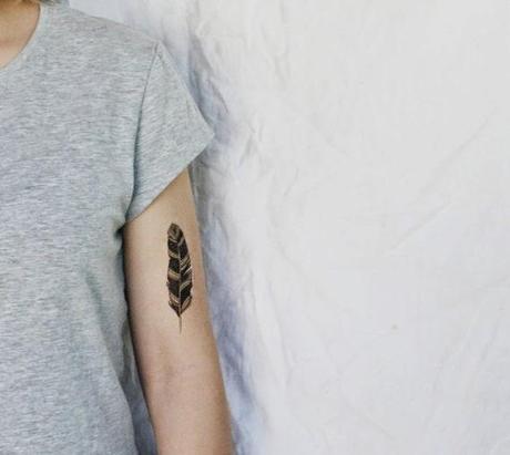 Black Ink Pigeon Feather Tattoo On Left Half Sleeve