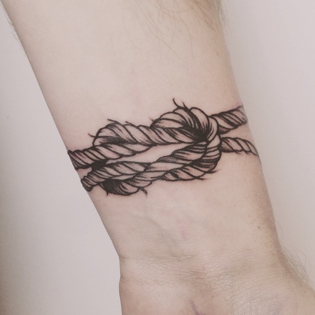 Black Ink Rope Knot Tattoo On Wrist