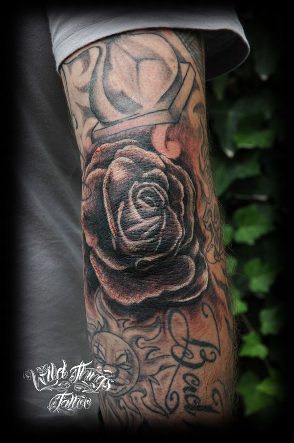 Black Ink Rose Tattoo On Elbow By Wild Things Tattoo