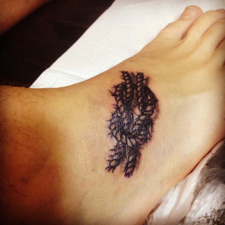Black Ink Square Knot Tattoo On Foot