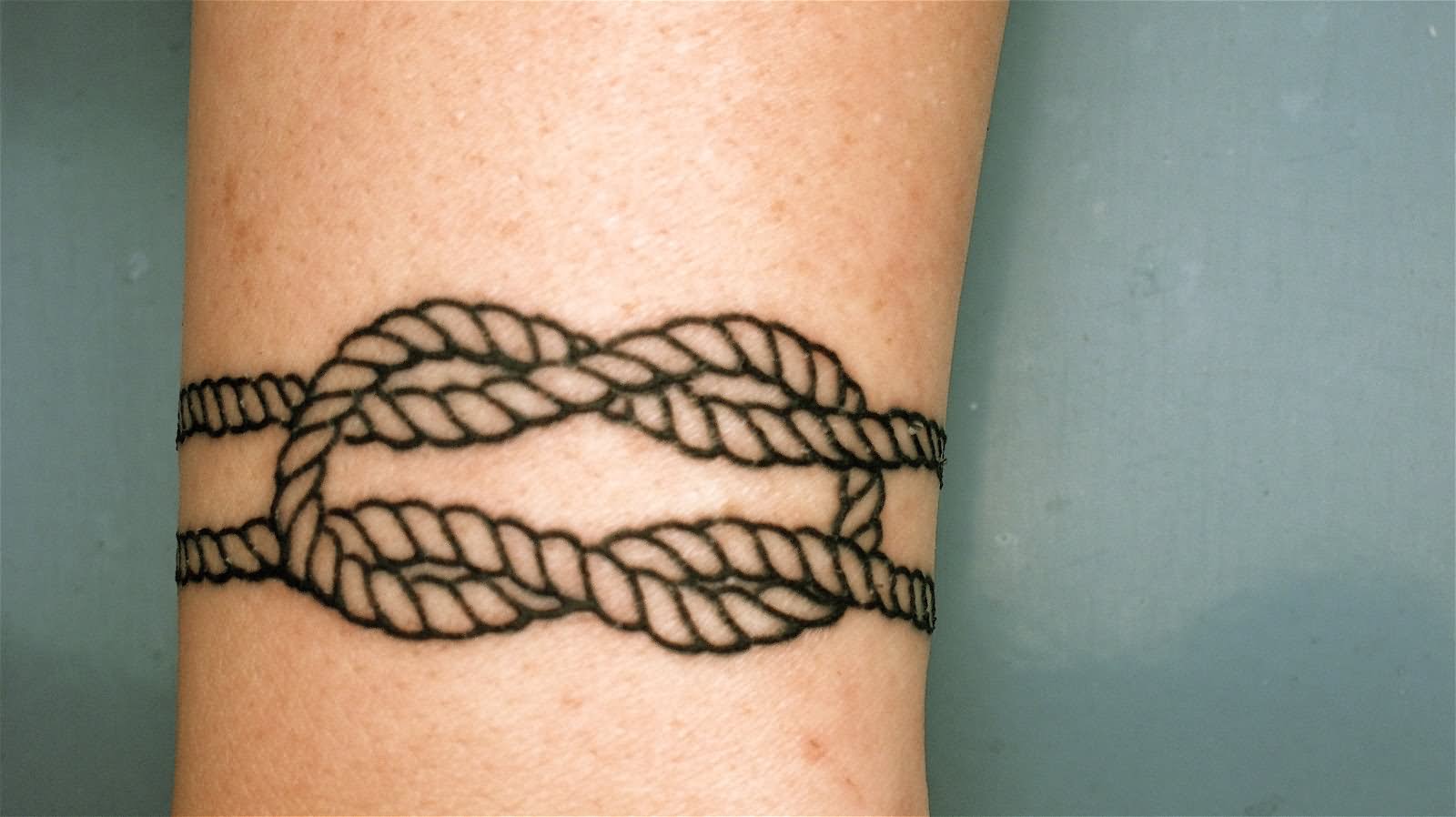Black Outline Rope Knot Tattoo Design For Arm