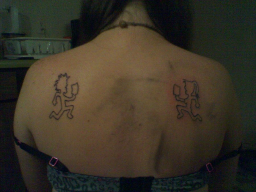 Black Outline Two Hatchetman Tattoo On Girl Upper Back By Emily