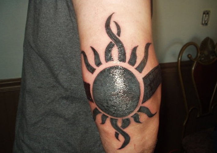 Black Tribal Sun Tattoo Design For Elbow
