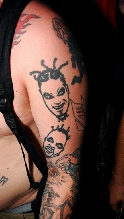 Black Two ICP Face Tattoo On Man Left Half Sleeve