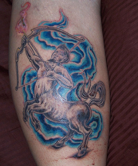 Blue Water Waves And Sagittarius Tattoo On Leg