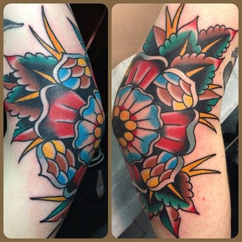 Colorful Traditional Flower Tattoo On Elbow