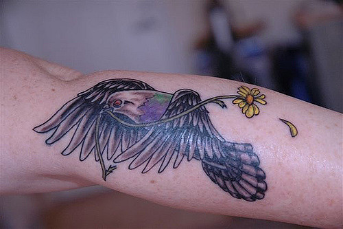 Flower In Flying Pigeon Beak Tattoo Design For Sleeve