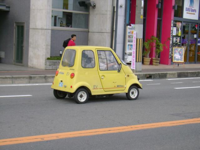 Funny Looking Little Yellow Car Picture