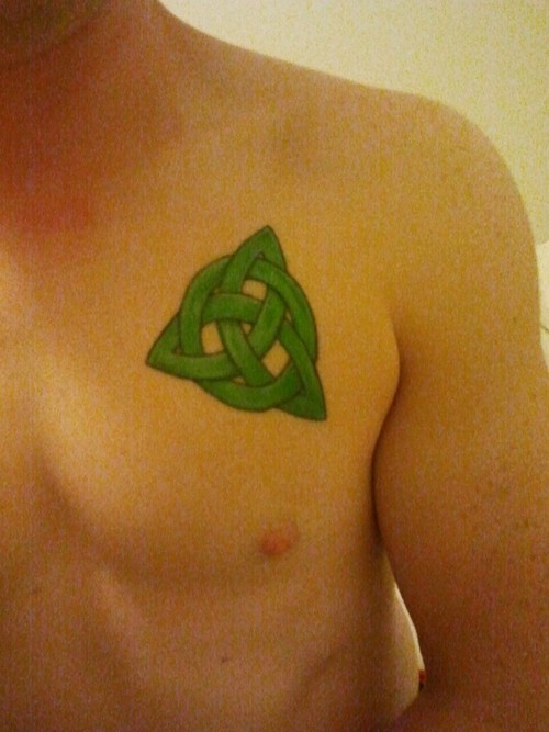 Green Ink Celtic Knot Tattoo On Man Chest