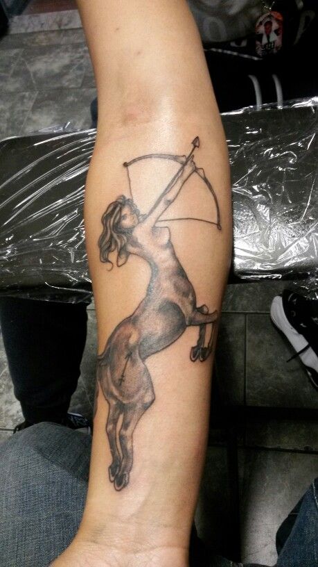 Grey Ink Sagittarius Tattoo On Forearm