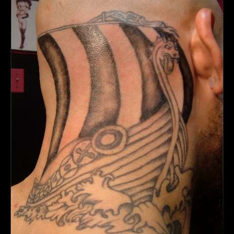 Grey Ink Viking Ship Tattoo On Back Neck For Men
