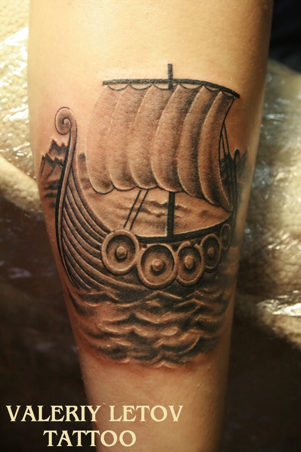 Grey Ink Viking Ship Tattoo On Leg
