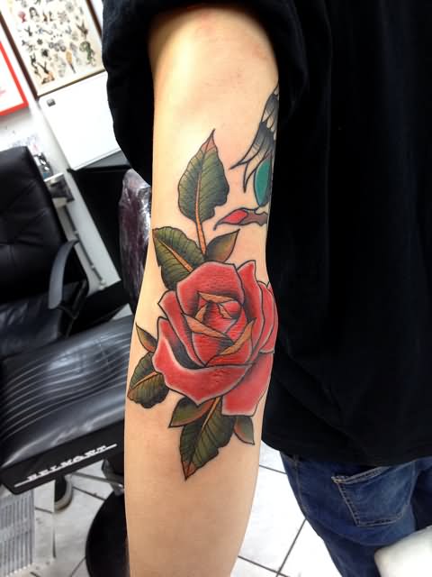 Impressive Red Rose Tattoo On Left Elbow