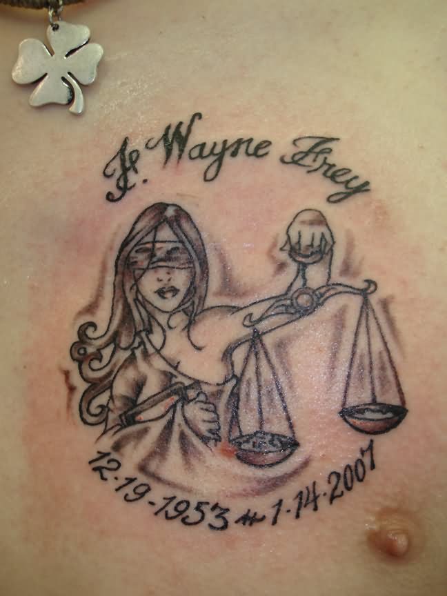 Memorial Justice Scale In Girl Hand Tattoo On Chest