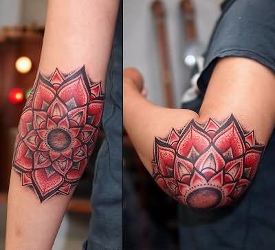 Red And Black Flower Tattoo On Left Elbow