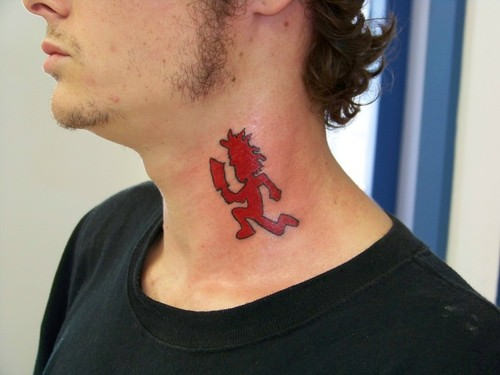 Red Hatchetman Tattoo On Man Side Neck