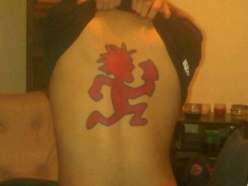 Red Hatchetman Tattoo On Man Upper Back