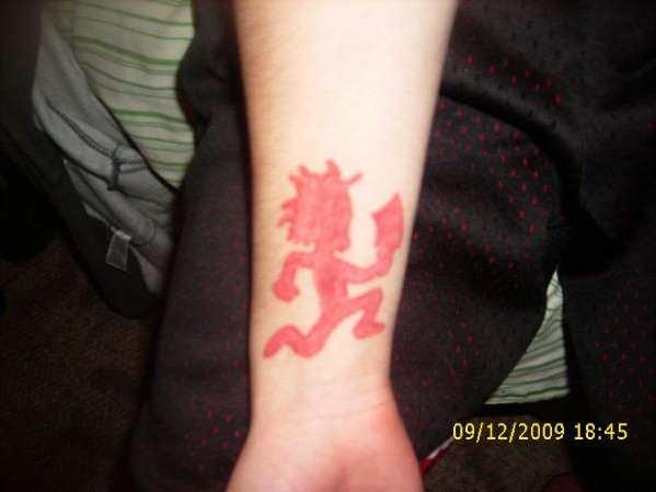 Red Hatchetman Tattoo On Wrist By Hugh G Wrection