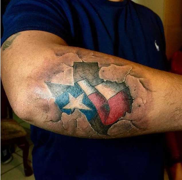 Ripped Skin USA Flag Tattoo On Elbow