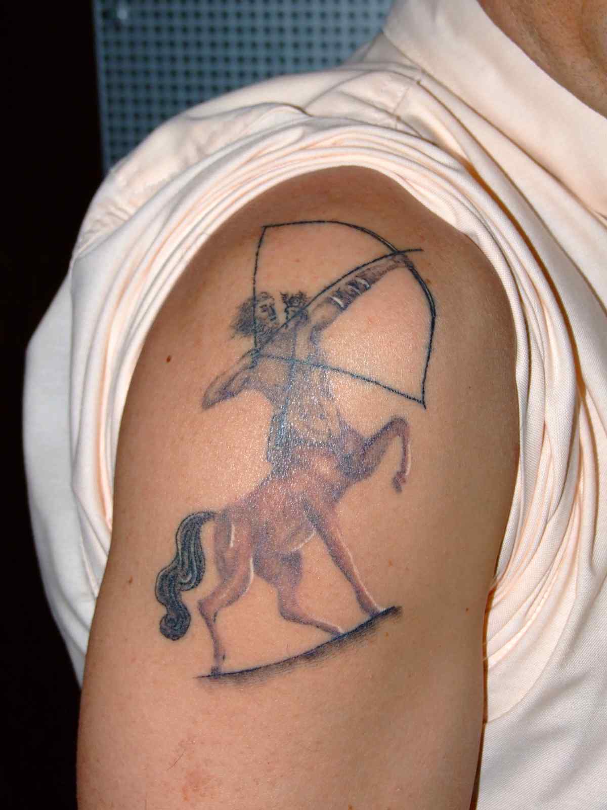 Sagittarius Tattoo On Man Right Shoulder