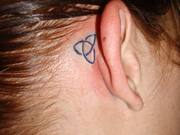 Simple Black Celtic Knot Tattoo On Girl Behind The Ear