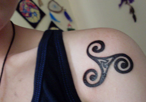 Simple Celtic Knot Tattoo On Left Front Shoulder