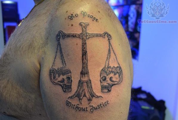Skull Justice Scale Tattoo On Man Left Shoulder