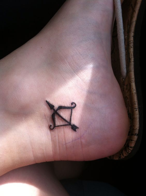 Small Black Ink Sagittarius Tattoo On Ankle