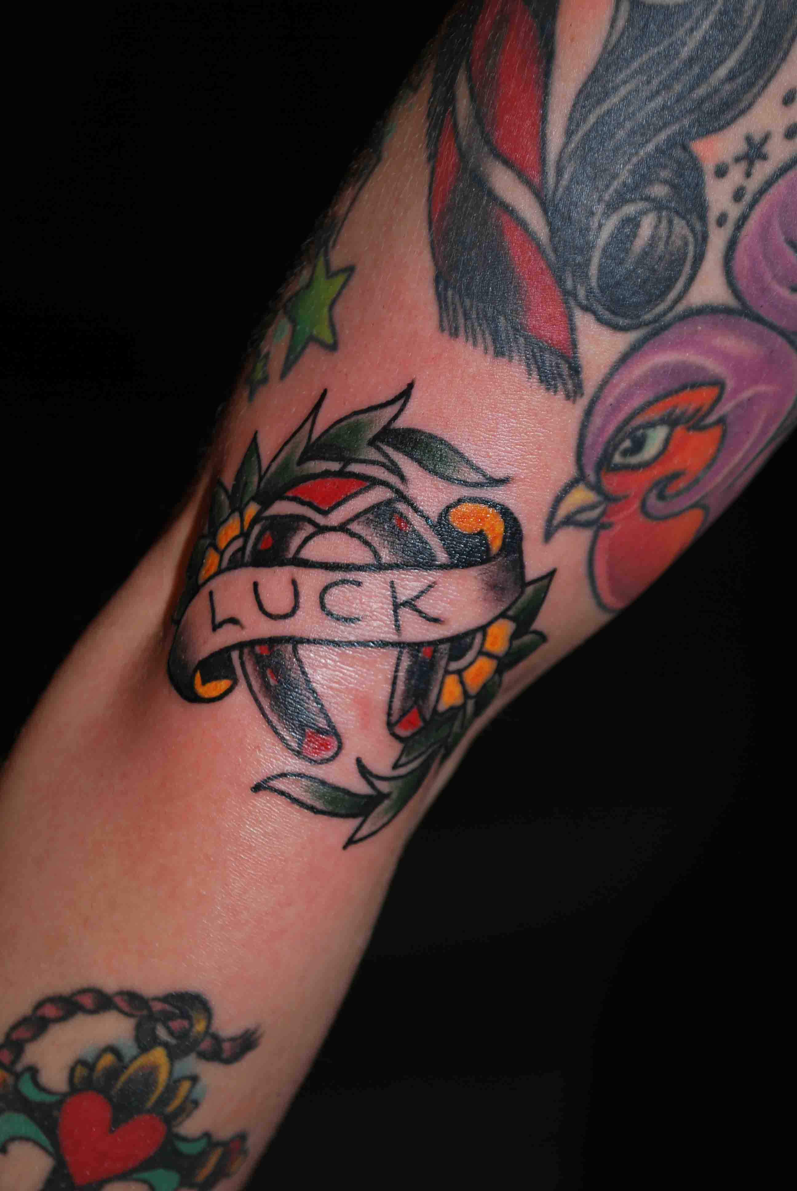 Traditional Horseshoe With Luck Banner Tattoo Design For Elbow