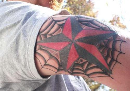 Traditional Nautical Star With Spider Web Tattoo On Right Elbow