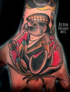 Traditional Pigeon In Flower Tattoo On Hand