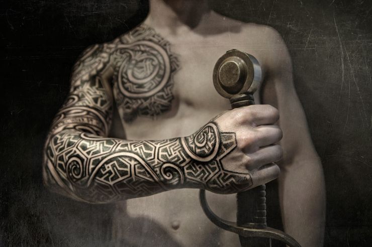 Traditional Viking Tattoo On Chest And Sleeve by Peter Walrus Madsen