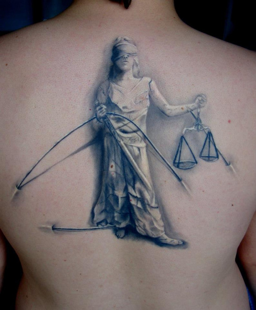 Grey Ink Justice Lady Tattoo On Upper Back