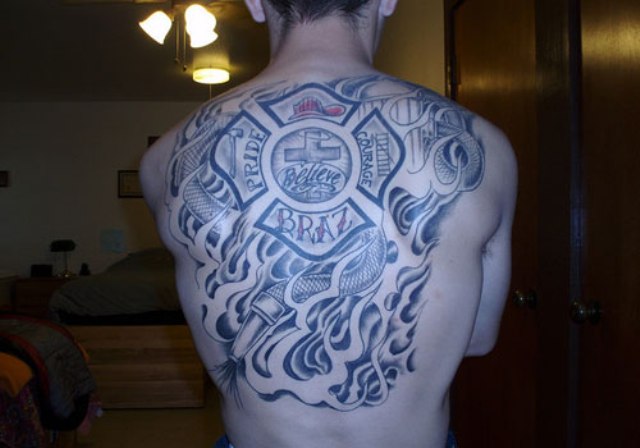 Amazing Tribal Firefighter Logo Tattoo On Man Upper Back