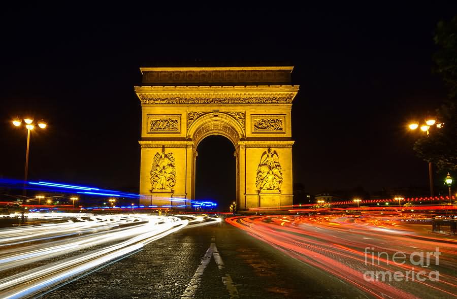 Arc de Triomphe At Night With Streaking Car Lights