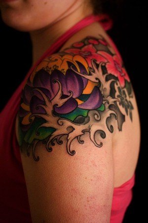 Awesome Colorful Floral Tattoo On Girl Left Shoulder